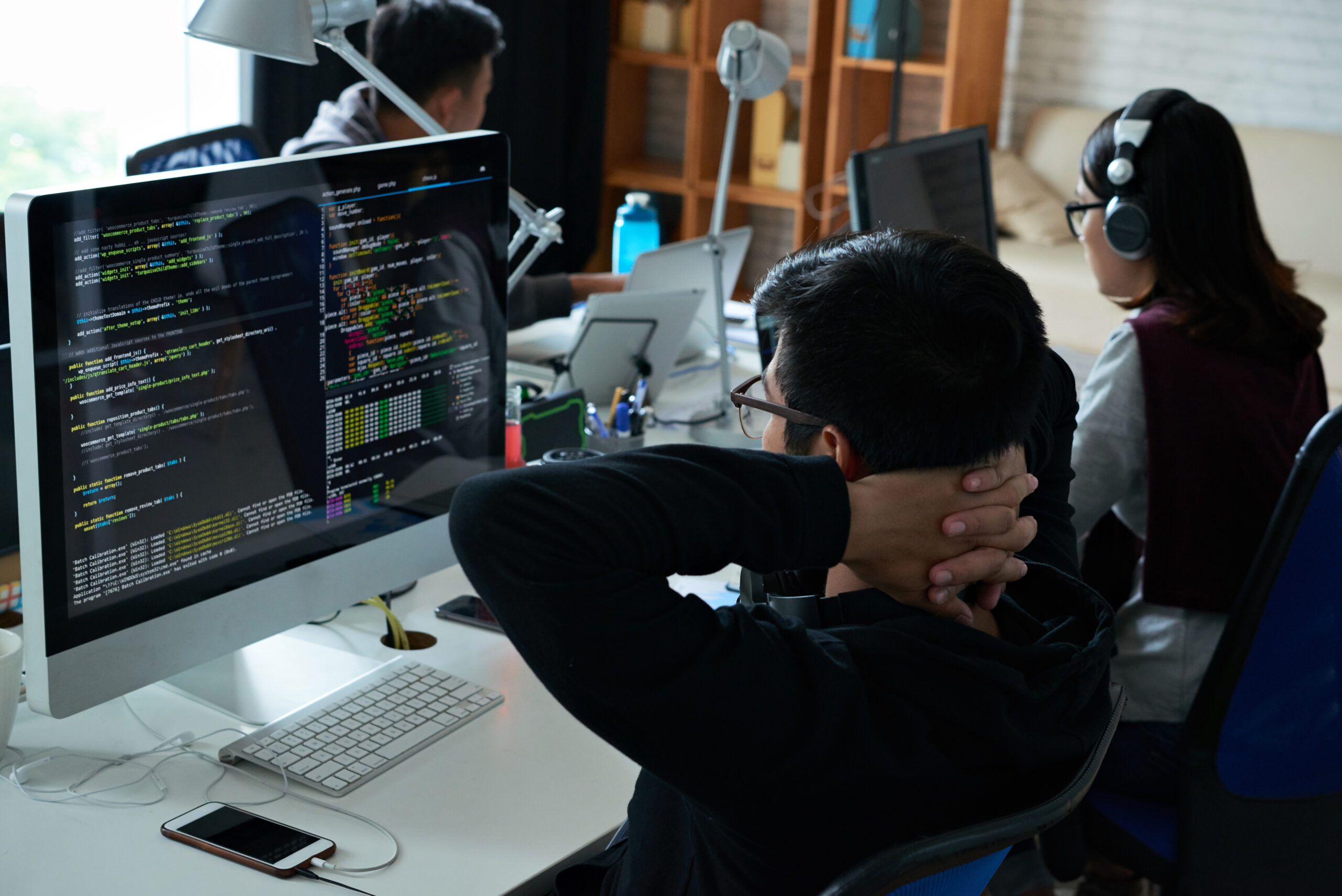 Team works on code at desks in office 2026 01 08 00 08 23 utc scaled